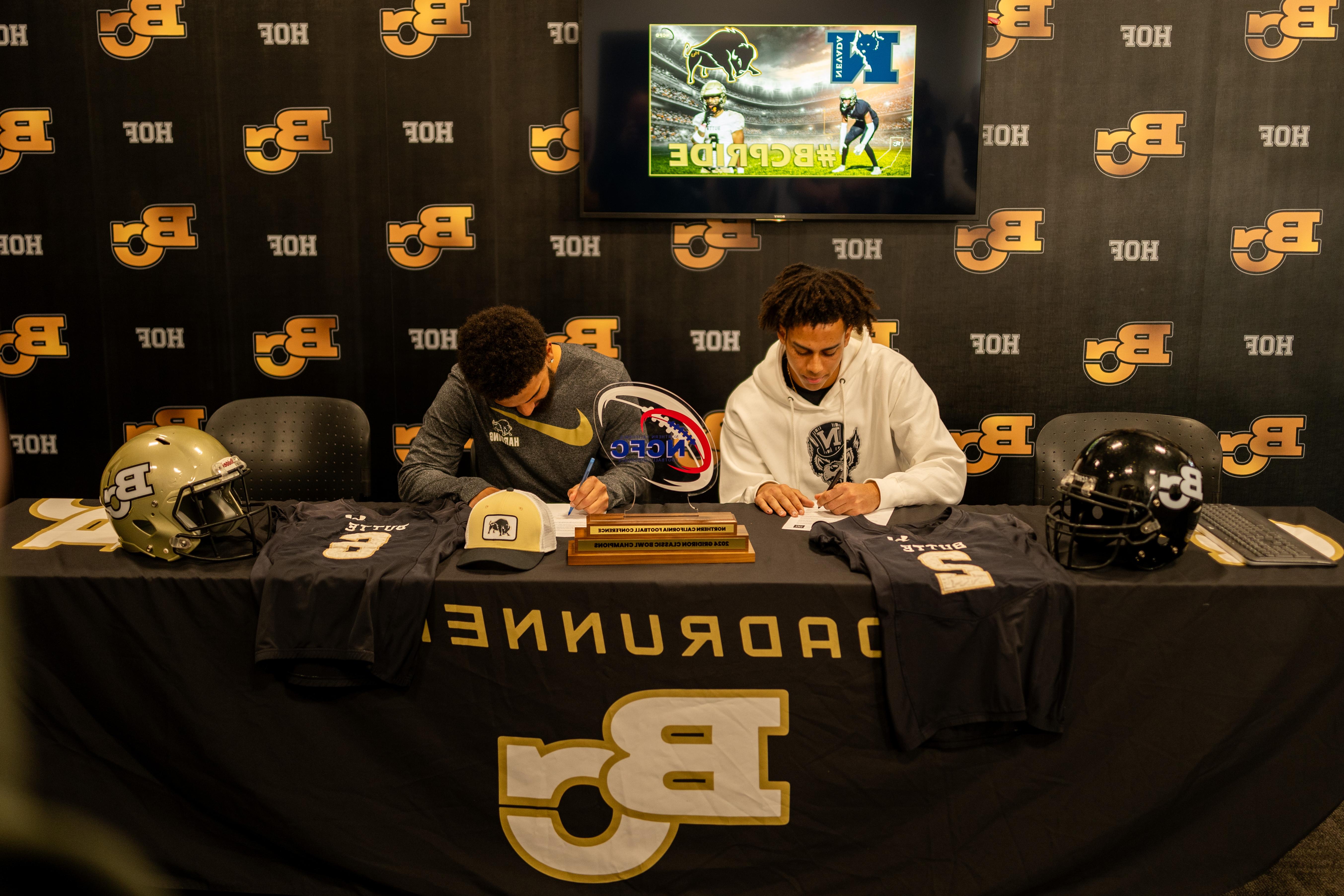 Bryson and Zach sign their letters of intent.